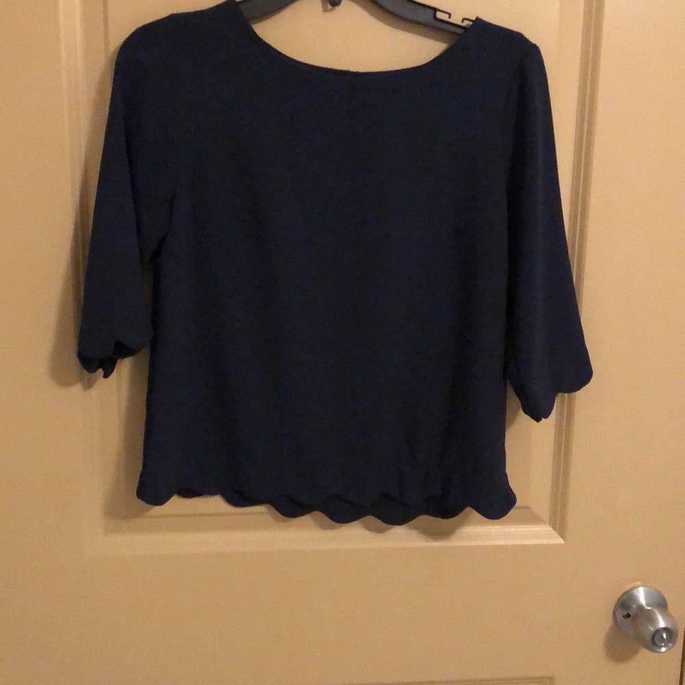 Scalloped blue top.